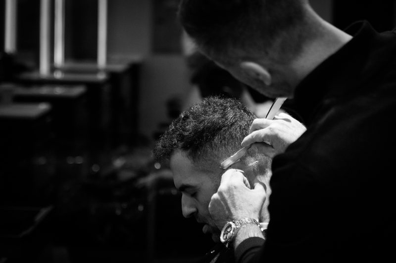 A straight razor shave, close, in black and white